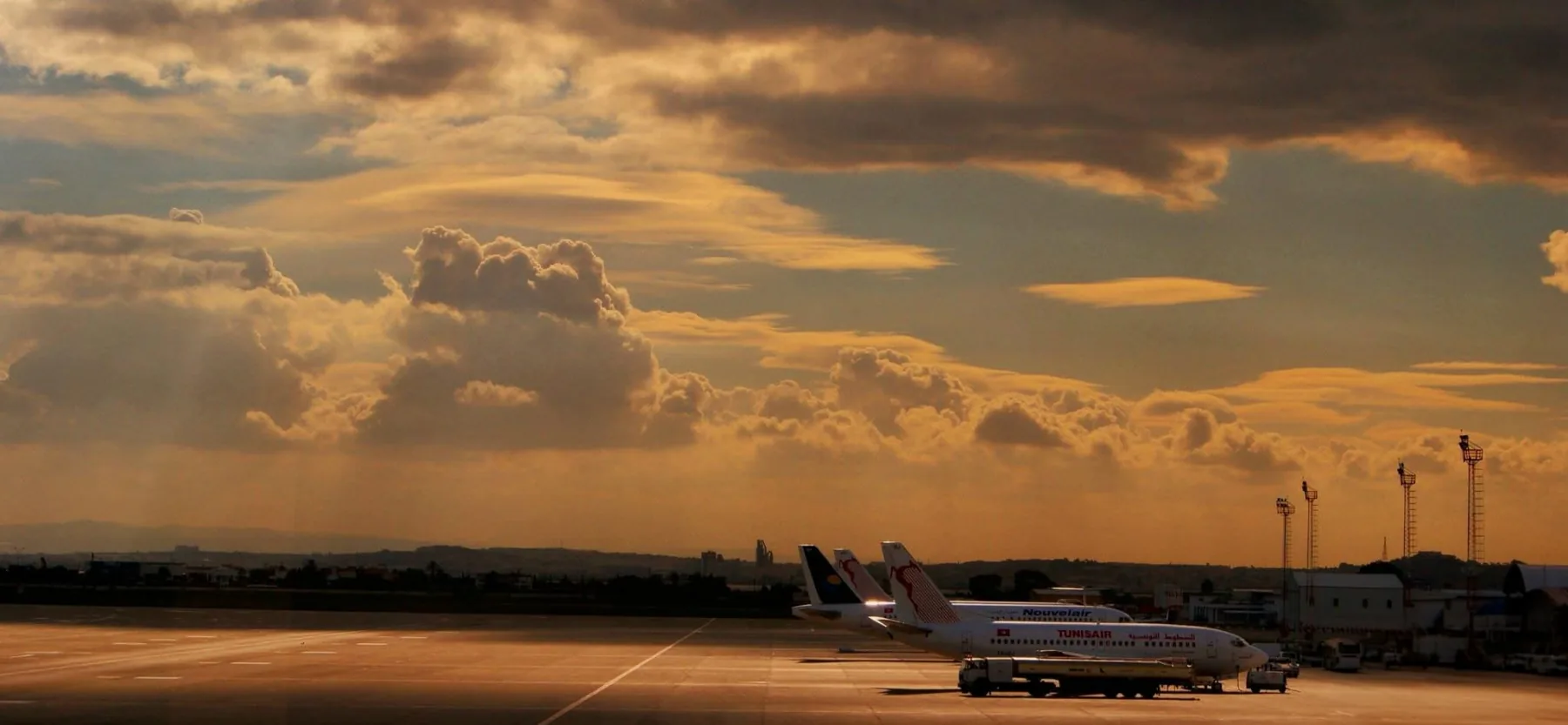 Aircraft beneath a golden evening sky