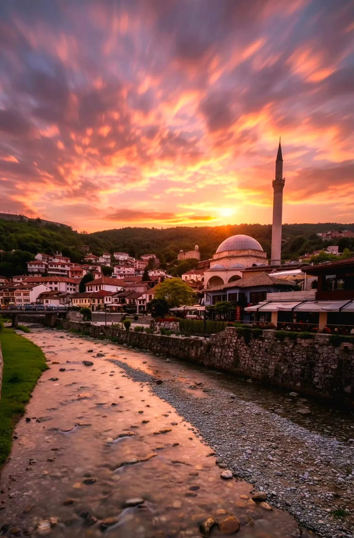 Historic riverside town at sunset